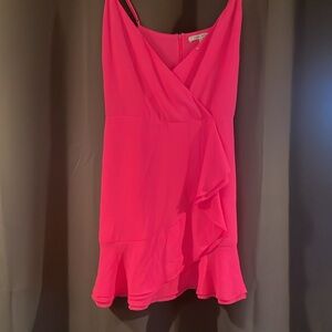 Hot pink mini dress with closure button in the front